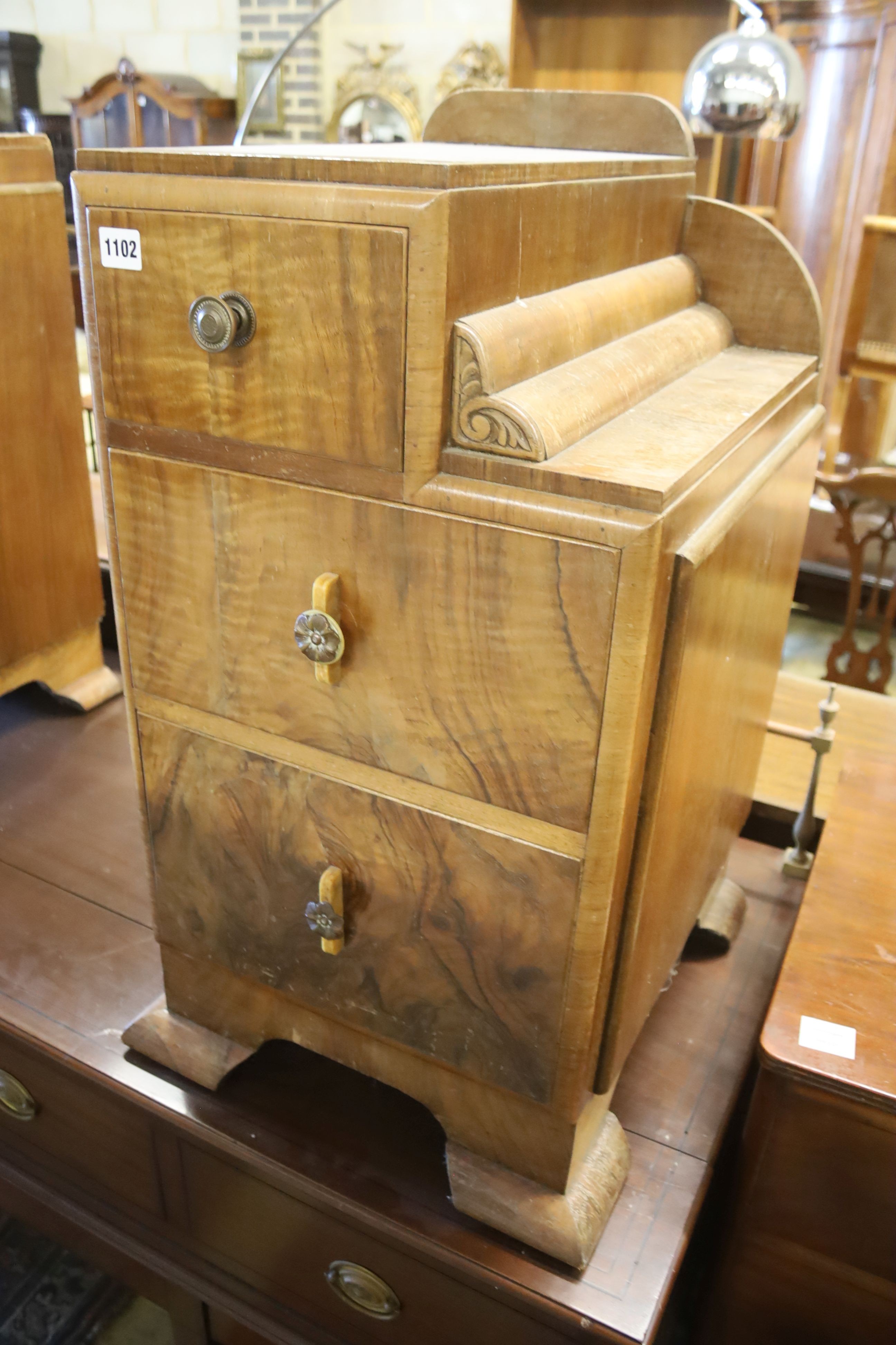 A pair of Art Deco style figured walnut bedside cabinets, width 40cm, depth 46cm, height 73cm